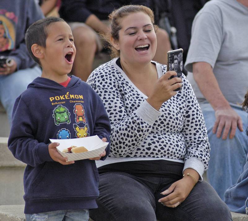 Gabriel and mom Ashley Banderas  of Tampico react to Zowa wrestlers at  the Taco Throwdown Events sponsored by Rock Falls Tourism Event at RB&W District September 27th, 2024.