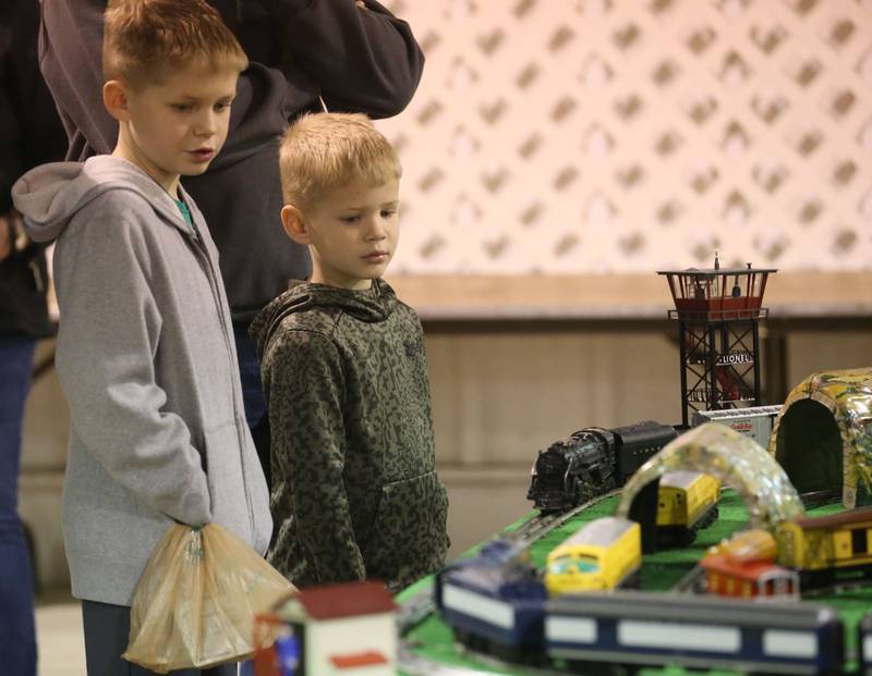 Hayse and Hunter Hasbrook of Annawan, watch a Lionel O Gauge train during the Model Train and Toy Show on Saturday, Feb. 14, 2026 at the Bureau County Fairgounds in Princeton.