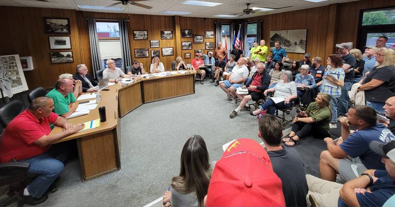 Citizens packed the Marseilles City Council chambers on Wednesday to voice opinions over the potential purchase of the Illinois Valley Cellular building.