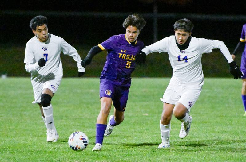 Mendota’s Mauricio Salinas (5) takes control of the ball against Genoa-Kingston's Ulises Ayala-Zavala (7) and Josue Leon (14) during the Class 1A Indian Creek Sectional Semifinal in Waterman on Wednesday, Oct. 29, 2025.