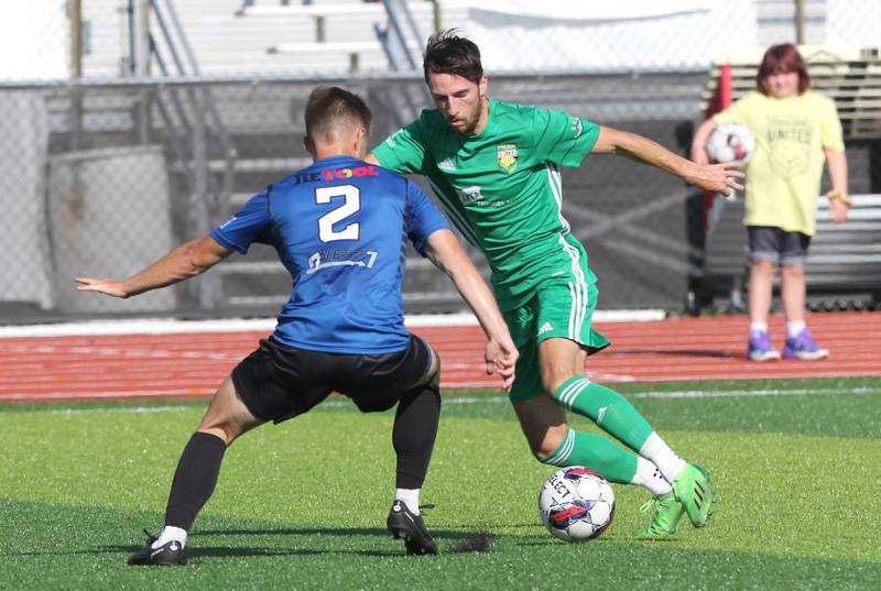 DeKalb County United's Josh Johansen (right) puts a move on a Rockford FC defender during their game Saturday, July 29, 2023, at the Soccer & Track and Field Complex at Northern Illinois University in DeKalb.