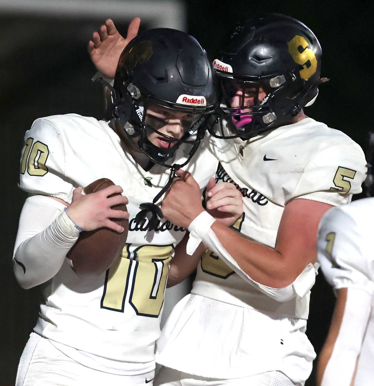 Sycamore's Burke Gautcher is congratulated by Sycamore's Kyle Prebil after scoring a touchdown during their game Friday, Oct. 20, 2023, at Morris High School.