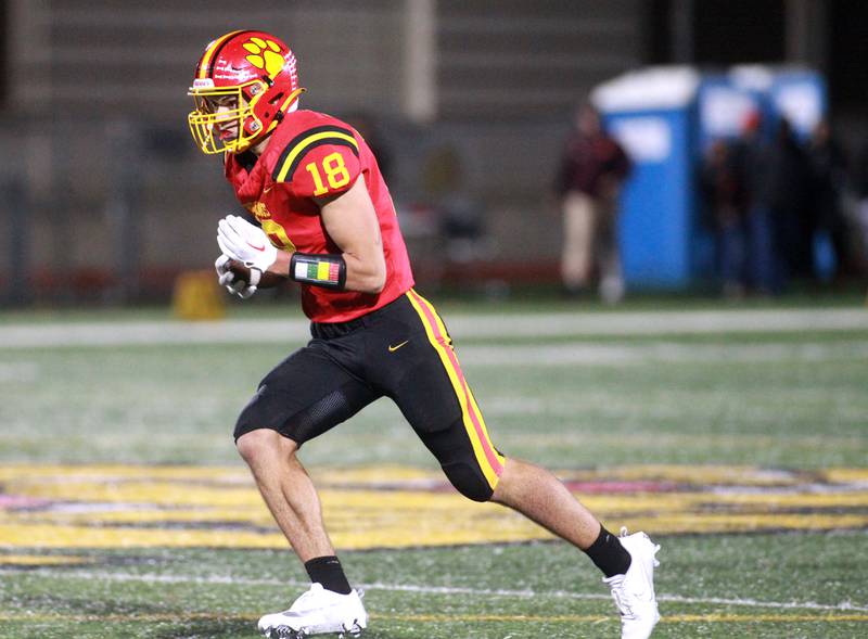 Batavia’s C.J. Valente carries the ball during a Class 7A round 1 playoff game against Brother Rice in Batavia on Friday, Oct. 27, 2023.