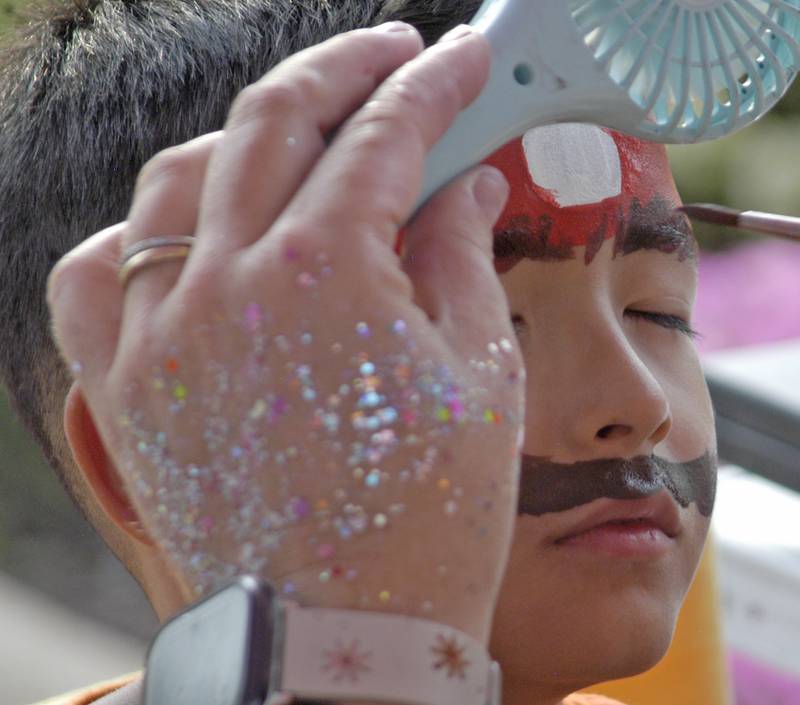 Leo Dallgas-Frey gets his face painted at Venetian Night in Dixon on Aug. 9, 2025.