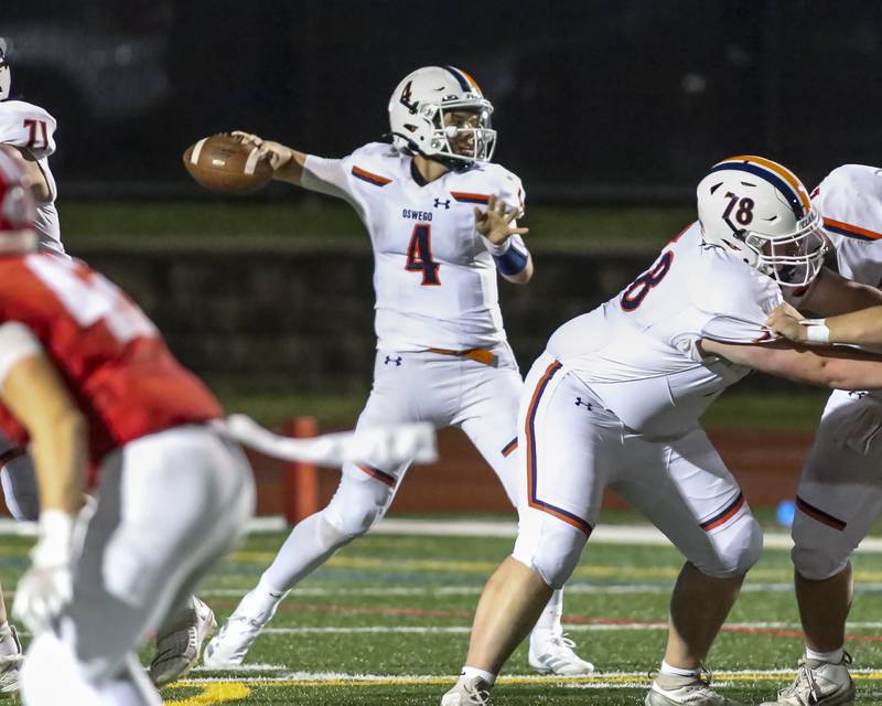 Oswego's Drew Kleinhans (4) passes during football game between Oswego at Naperville Central  on Friday, Aug 29, 2025  in Naperville.