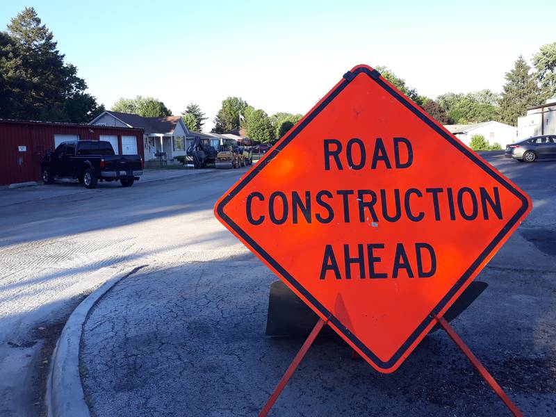 Construction signs and equipment are set up for road work to begin soon on Fulton Street, Highland Place from Otter Creek Road to Martha Lane.