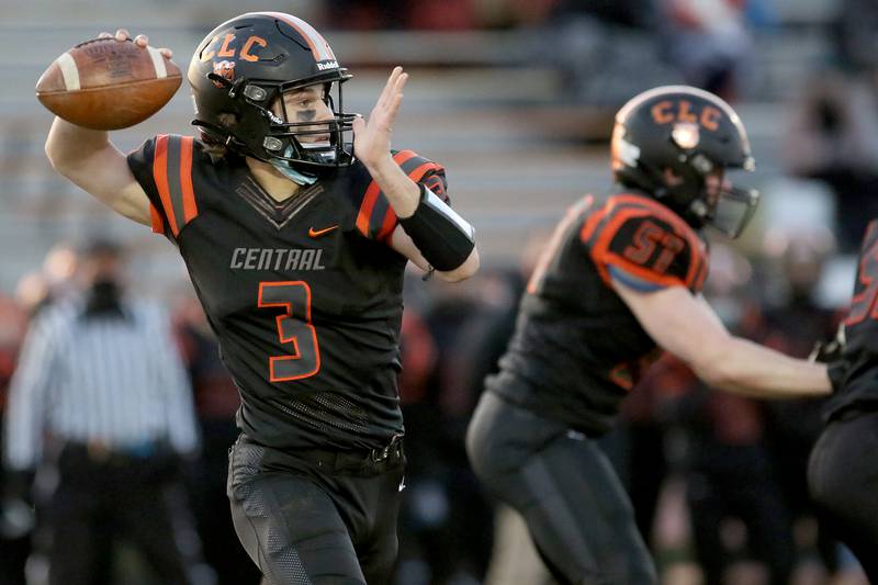 Crystal Lake Central quarterback Colton Madura looks for an open man to pass to against Prairie Ridge's Carter Evans during their football game at Crystal Lake Central High School on Thursday, April 1, 2021 in Crystal Lake.