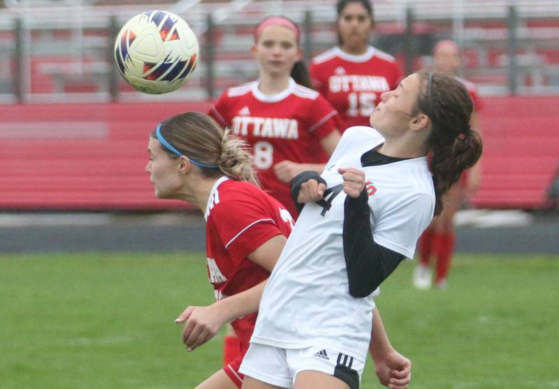 Ottawa's Ayla Covalsky beats out L-P's Amelia Buckley to a header on Wednesday, April 30, 2025 at King Field in Ottawa.