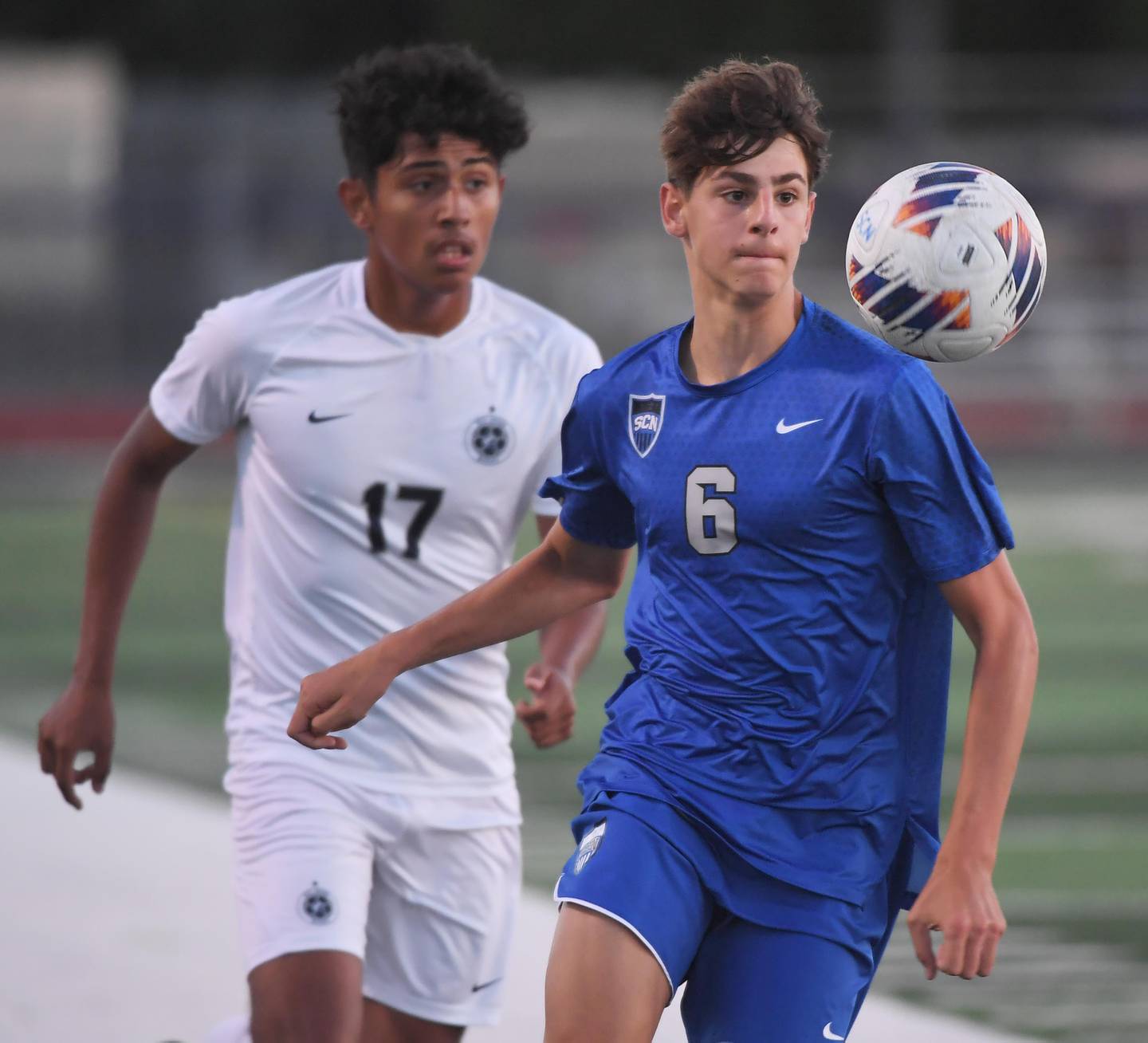 St. Charles North’s Dino Valenti controls the ball against West Chicago’s Hector Velazquez in a boys soccer game in St. Charles on Wednesday, August 30, 2023.