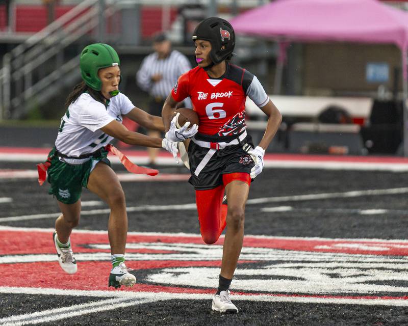 Bolingbrook's Kennedy Williams (6) runs with the ball during flag football game between Plainfield Central at Bolingbrook Wednesday, Sept 3, 2025  in Bolingbrook.