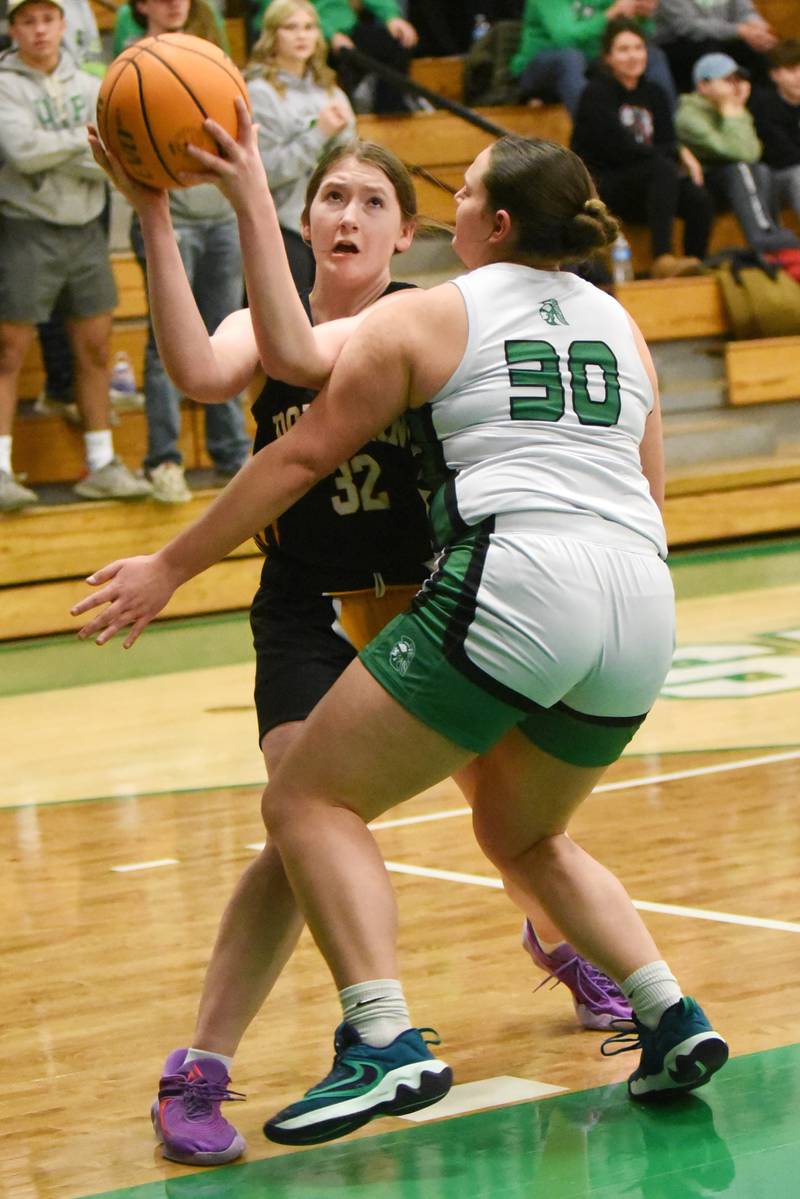Donovan-St. Anne's Deven Walwer, left, looks to shoot as Dwight's Isabella Bunting defends during an IHSA Class 1A Dwight Regional semifinal game Monday, Feb. 17, 2025.