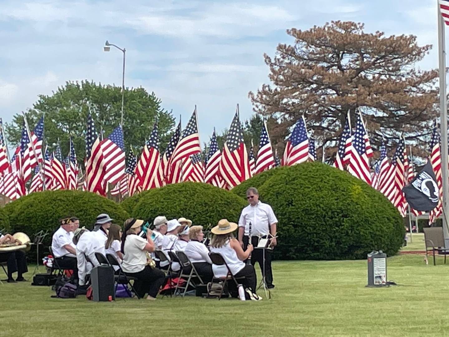 Musicians ready to play patriotic songs at the Spring Valley Memorial Day program on Monday, May 29, 2023, an event notable for the nearly 500 flags procured for deceased veterans.