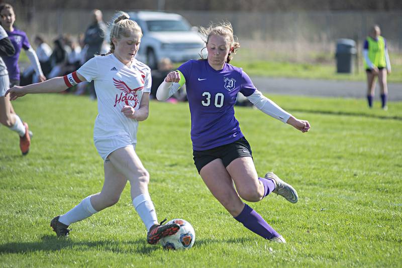 Oregon's Sophie Stender and Dixon's Katie Drew go after a ball Tuesday, April 26, 2022.