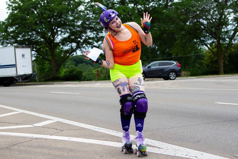 Kae Edgcomb waves on Saturday, June 8, 2024 at Jordan Block Park in Ottawa.