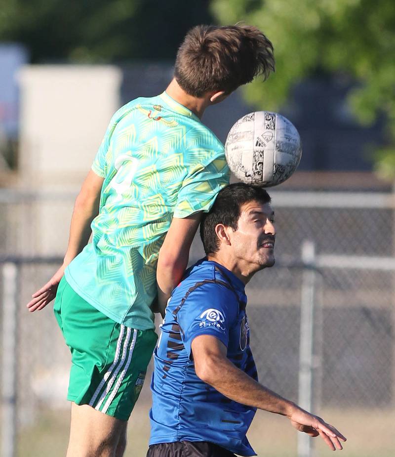 DeKalb County United and Rockford FC player go up for a header Wednesday, July 13, 2022, as the teams battle for the 815 Cup at the Northern Illinois University Soccer and Track and Field complex in DeKalb.