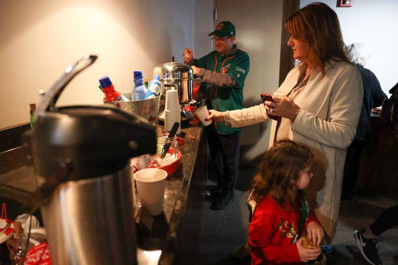 Event goers stop at the hot chocolate bar at the Joliet Slammers annual Holiday Open House on Saturday, December 2nd at Duly Health and Care Field in Joliet.