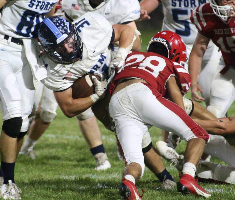 Bureau Valley's Cameron Lemons lunges for a few extra yards past Hall's Deanthony Weatherspoon on Friday, Sept 8, 2023 at Richard Nesti Stadium.