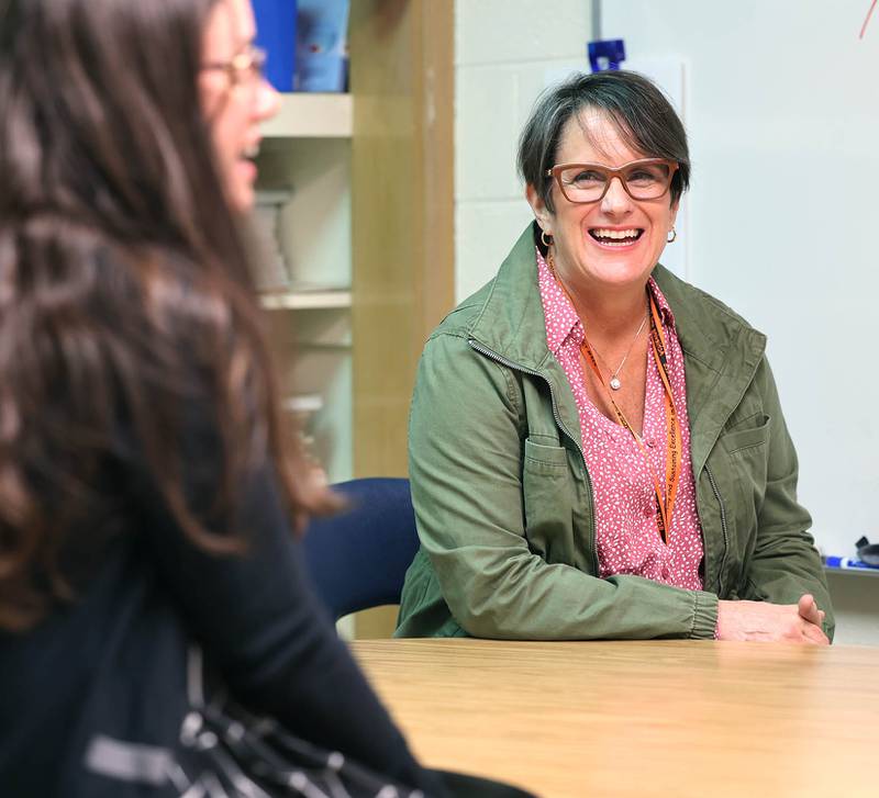 Mary Lynn Buckner, (right) longtime special education teacher at Littlejohn Elementary School in DeKalb, listens as a colleague talks Wednesday, Feb. 23, 2023, about about why Buckner is such a valuable asset to students and faculty at the school.