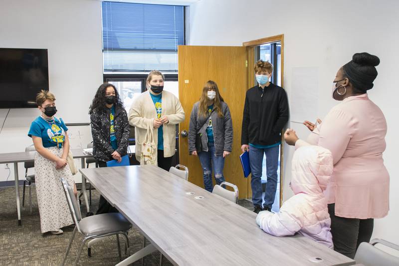 Youth Engaged in Philanthropy members touring the Community of One building with Founder and Executive Director Danita Sims of Passion Pursuit, Inc. during a grant application visit in March