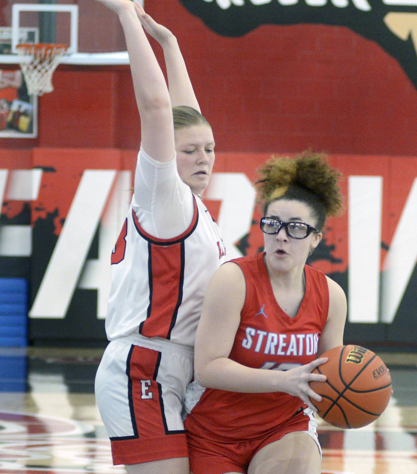 Streator's Lahla Thompson looks to drive to the hoop against Earlville's Natalie Hall in the second quarter Saturday at Earlville.