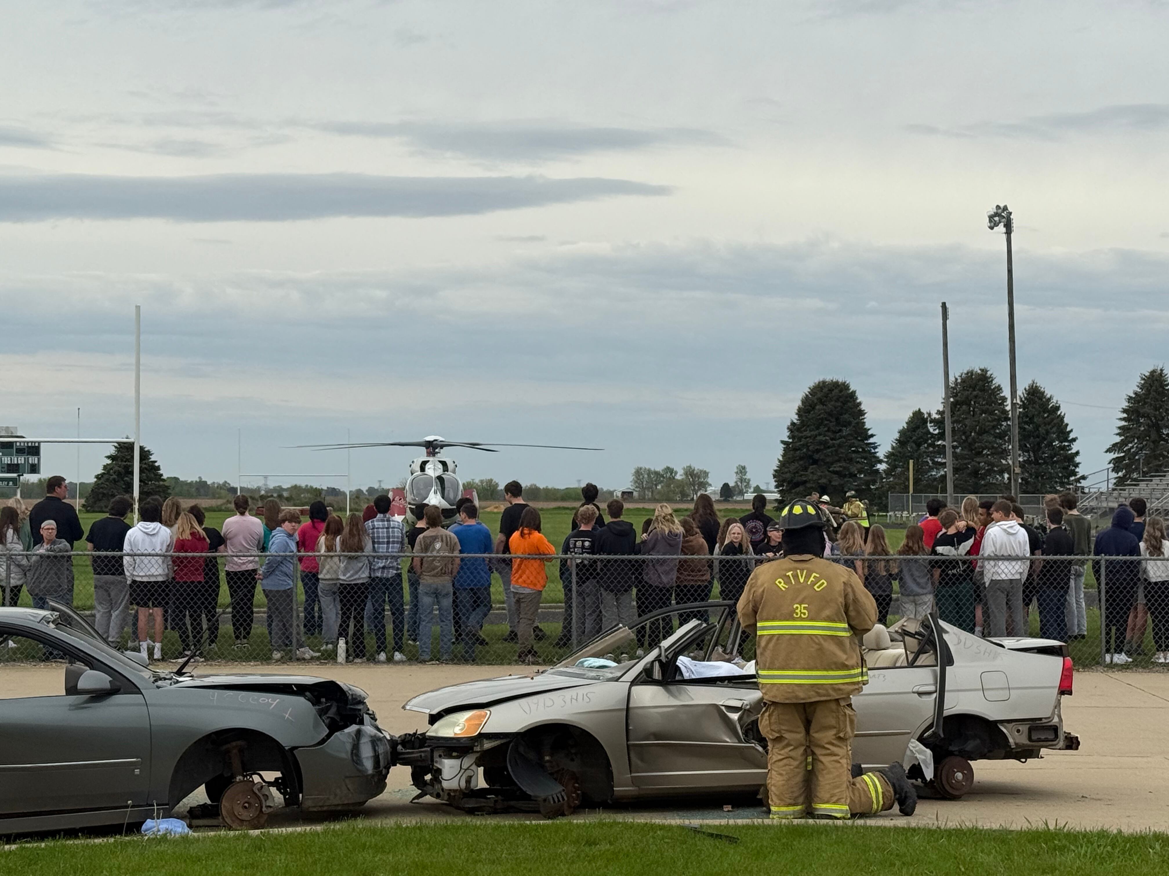 First responders tend to a mock crash scenario Wednesday, April 30, 2025, during an Operation Prom event at Woodland School in rural Streator.