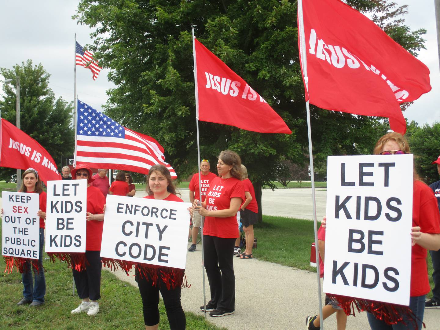 Molly Krempski of Yorkville, center, holding flag, led a protest against the drag show at the Pinz Entertainment Center in Yorkville on Aug. 21, 2022. Holding signs are, from left, Amy Adamec of Oswego, Barb Conger of Naperville, and Brynn Krempski and Macy Krempski, both of Yorkville.