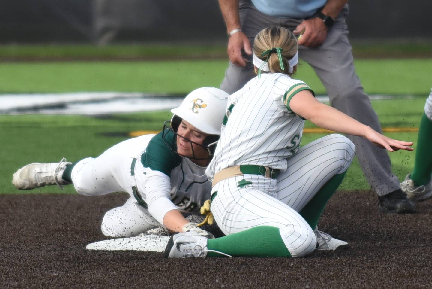 Coal City's Madi Petersen, left, slides around a tag attempt from Seneca's Alyssa Zellers to steal second base during the Class 2A Seneca Sectional semifinals Tuesday, May 27, 2025.