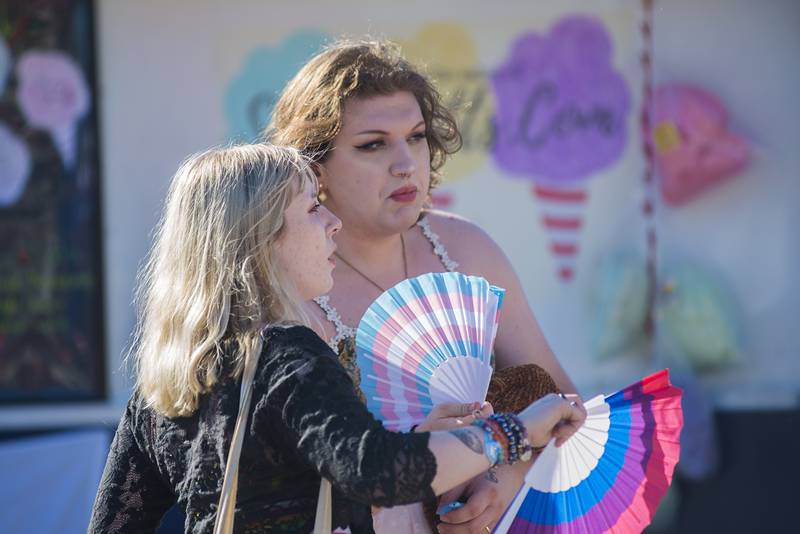 Sabrina Scott (left) of Rock Falls and Freya Mattingly of Sterling wait in line for an icy treat Saturday, June 18, 2022 at Dixon’s Pride Fest.