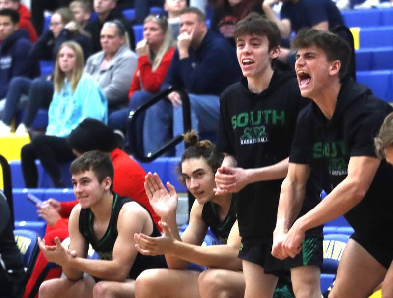Crystal Lake South players get revved up as the Gators build a second-half lead over Huntley during the title game of the Johnsburg Thanksgiving tournament in boys basketball on Friday.