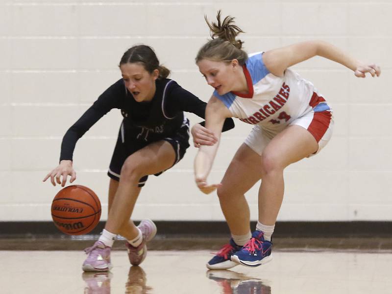 Rockford Lutheran's Soraya Parker chases down a loose ball in front of Marian Central's Abbey Miner during a non-conference girls basketball game Monday, Dec. 12, 2022, between Marian Central and Rockford Lutheran at Marian Central Catholic High School, in Woodstock.