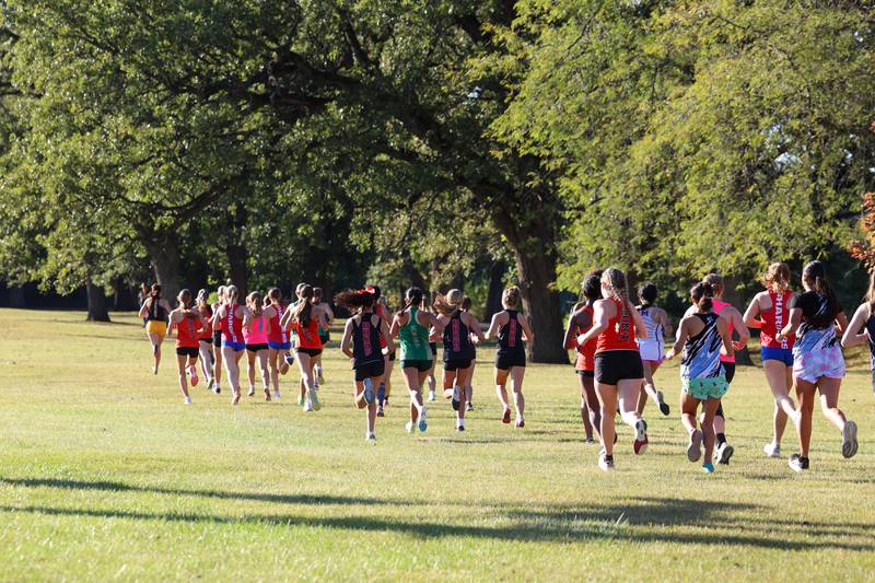 Runners from area schools begin the the girls 3-mile race during All-Area Cross Country meet on Wednesday, Oct. 8, 2025, at Kankakee Community College.