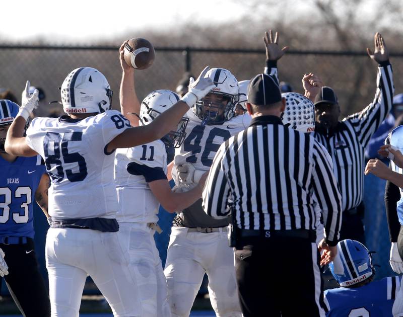 Cary-Grove's Luca Vivaldelli, (left) Peyton Seaburg, (center) celebrate a Logan Abrams touchdown during a IHSA Class 6A semifinal playoff football game against Lake Zurich on Saturday, Nov. 18, 2023, at Lake Zurich High School.