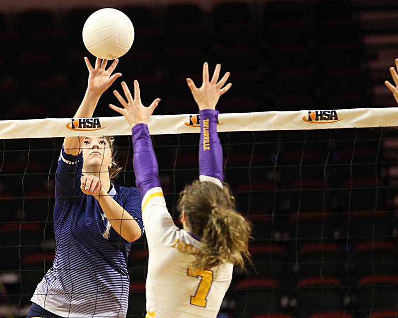 Nazareth Academy's Olivia Austin sends the ball over the net past Taylorville's Olivia Woodward in the Class 3A semifinal game on Friday, Nov. 11, 2022 at Redbird Arena in Normal.