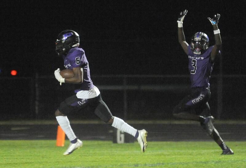 Plano running back Waleed Johnson (6) runs a single play on offense against Westmont, for a touchdown, signaled by teammate Thomas Harding (3) during a varsity football game at Plano High School on Friday, Sept. 9, 2022.