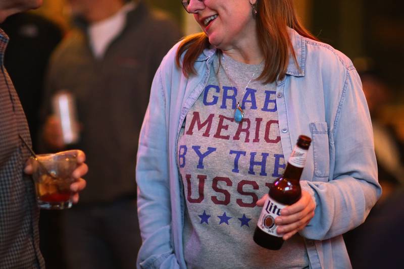 Republicans and supporters socialize during an election night watch party for local republicans at Niko's Red Mill Tavern on Tuesday, Nov. 3, 2020 in Woodstock.