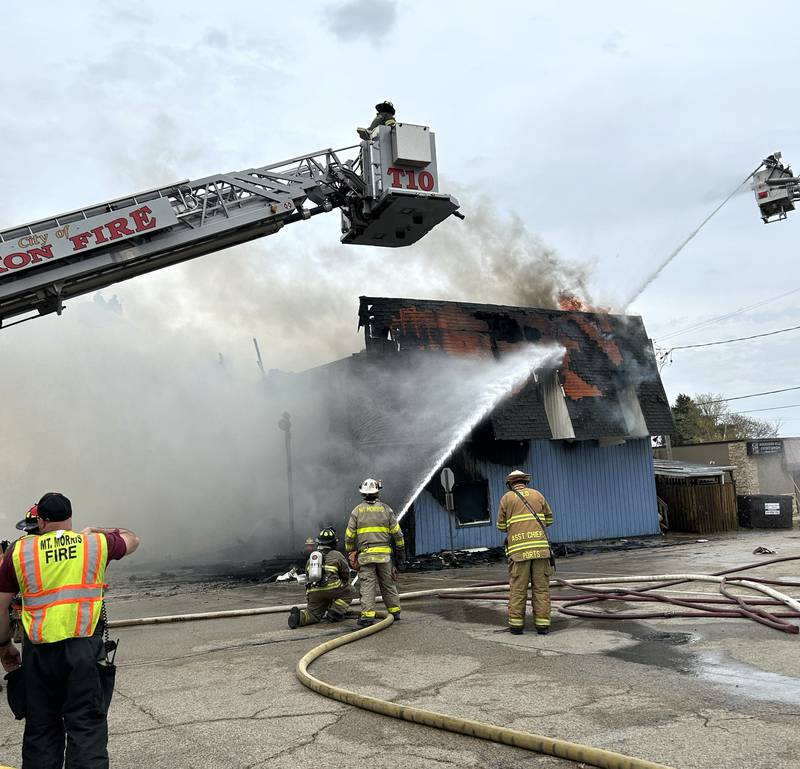 Mt. Morris firefighters responded first to a structure fire at the corner of Main Street and Wesley Avenue in downtown Mt. Morris on Tuesday, April 16, 2024. The wooden structure housed two apartments and Sharky's Sports Bar. No injuries were reported. Firefighters from many area departments battled high winds during the afternoon blaze.
