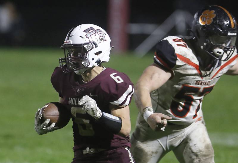 Prairie Ridge's Luke Vanderwiel cuts away form the pursuit of Crystal Lake Central's Tommy McNeil during a Fox Valley Conference football game on Friday, Oct. 13, 2023, at Prairie Ridge High School in Crystal Lake.