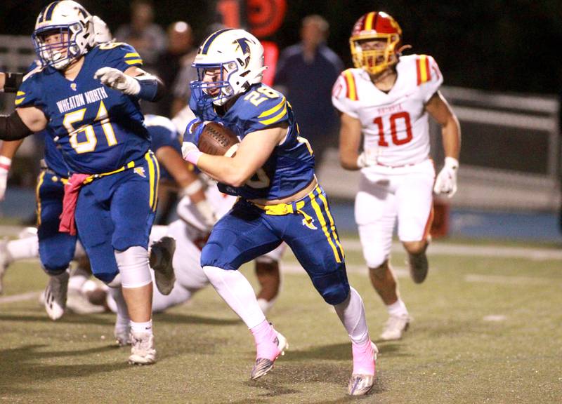 Wheaton North’s Max Serbick carries the ball during a game against Batavia on Friday, Sept. 27, 2024 at Wheaton North.