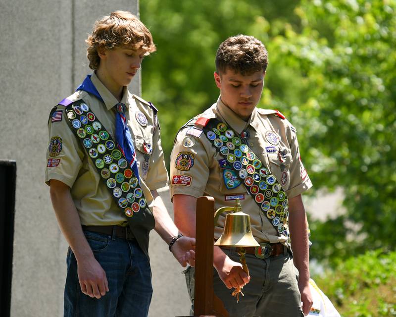 Yorkville boy scouts Tristan Dhuse and Anthony Cella Jr.  rings the bell after each name was read of the fallen soldiers from Kendall County during the Memorial Day event on Monday May 25, 2026, held at Town Square Park in Yorkville.