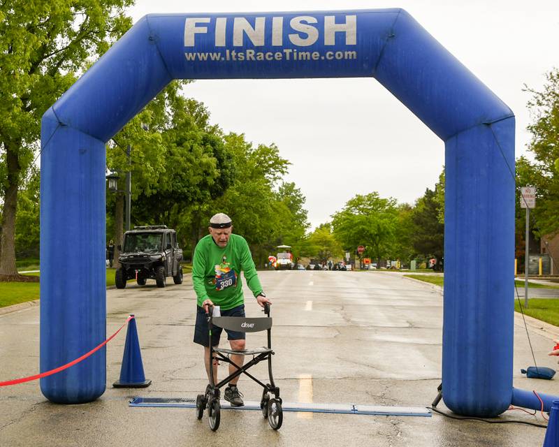 Hank Calewell, 90, of Park Ridge completes the Race to the Flag 5k on Sunday May 25, 2025, with a time of1:03:20 held at Ty Warner Park in Westmont.