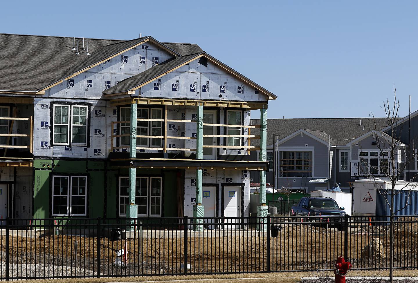 A building under construction on Monday, March 28, 2022, at the Springs at Three Oaks apartments.