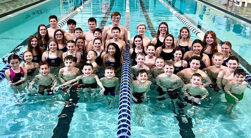The Ottawa Dolphins' state competitors pose in the pool. The youth swim team brought home multiple top-five finishes from the 2024 Illinois YMCA State Championships.