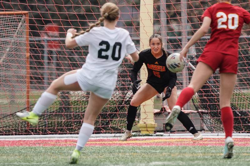Batavia’s Gianna Reid (15) defends the net against a shot by Oswego East's Catie Sloan (left), during a soccer match at Batavia High School on Saturday, March 29, 2025.
