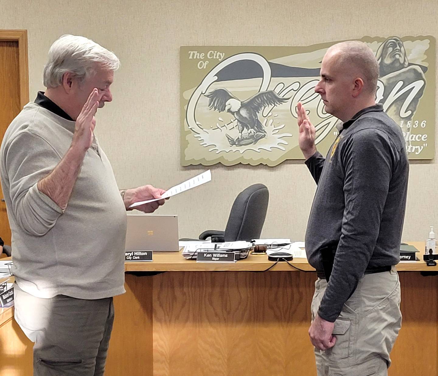 Oregon Mayor Ken Williams, left, swears in Joseph Brooks as Oregon's new chief of police on Sept. 27. Brooks will become chief effective Oct. 3.