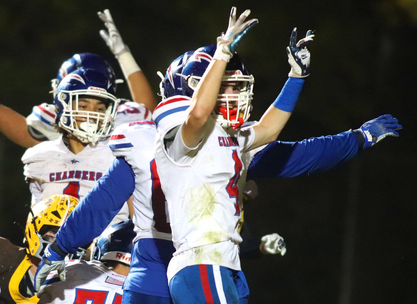 Dundee-Crown’s Ryan Pierce and the Chargers celebrate a touchdown in varsity football  at Jacobs High School in Algonquin on Friday, Oct. 10, 2025.