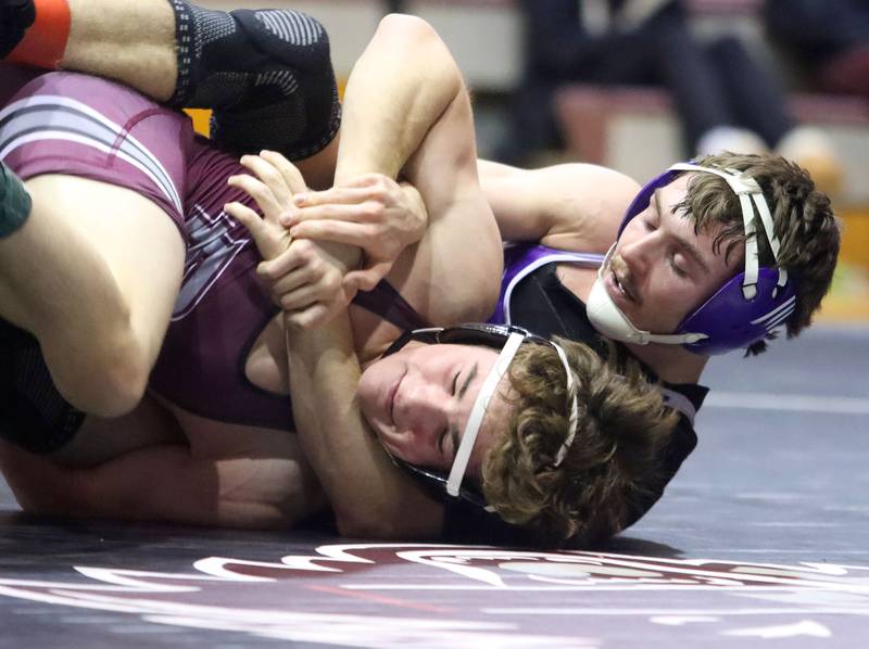 Prairie Ridge’s Matt Moritz, front, battles Hampshire’s Mike Brannigan at 157 pounds in varsity boys wrestling on Thursday, Dec. 4, 2025, at  Prairie Ridge High School in Crystal Lake.