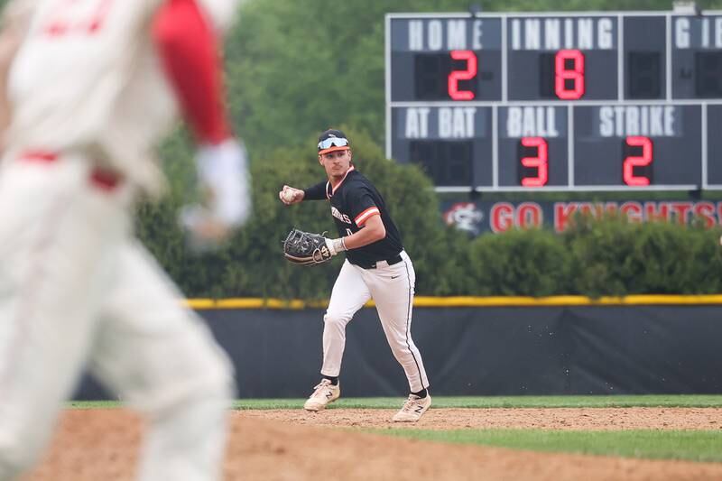 Lincoln-Way West’s Tyler Koscinski makes a throw to first for the out against Lincoln-Way Central on Monday, May 8, 2023 in New Lenox.