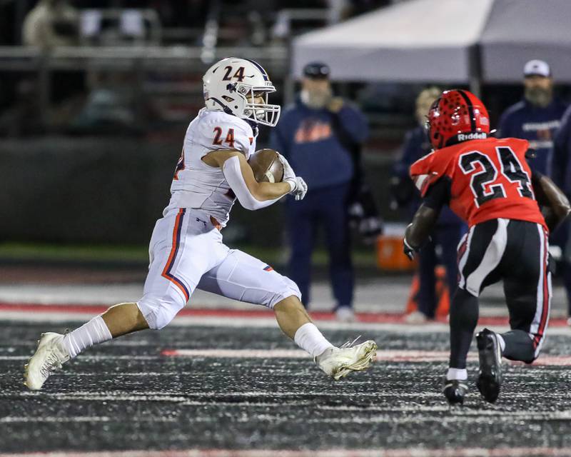 Oswego's Ayden Villa (24) makes a move on Bolingbrook's Alyias McNulty (24) during a football game between Oswego at Bolingbrook on Friday, Oct 4th, 2024  in Bolingbrook.