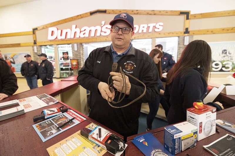 Rock Falls Fire Chief Ken Wolf displays a common, yet dangerous extension cord during a fire safety event Saturday, Jan. 11, 2025, at the Northland Mall. Wolf spearheaded a campaign where users can turn these cords in for a safer power strip.