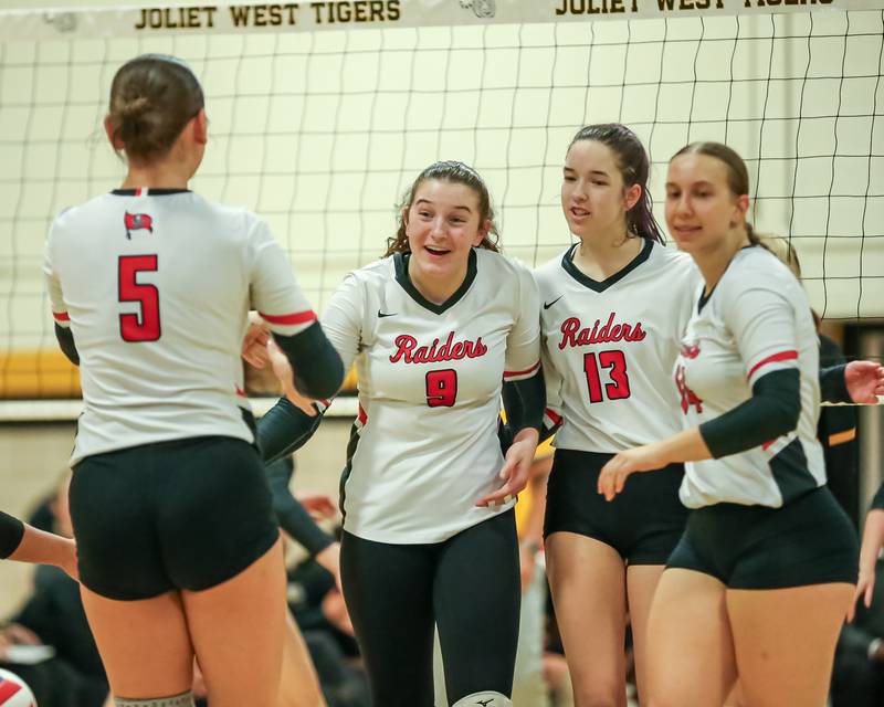 Bolingbrook celebrates a point during regional final volleyball match between Bolingbrook at Joliet West.  Oct 26, 2023.